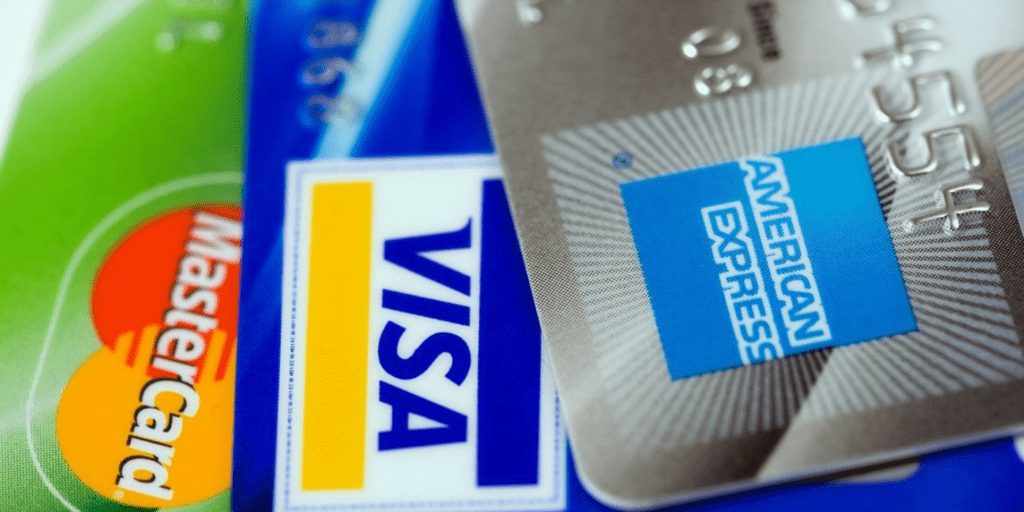 visa, mastercard, and AMEX credit cards on top of eachother