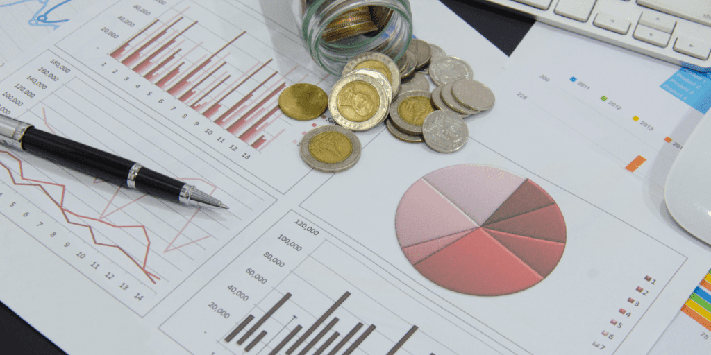 documents and money on a desk dedicated to investments