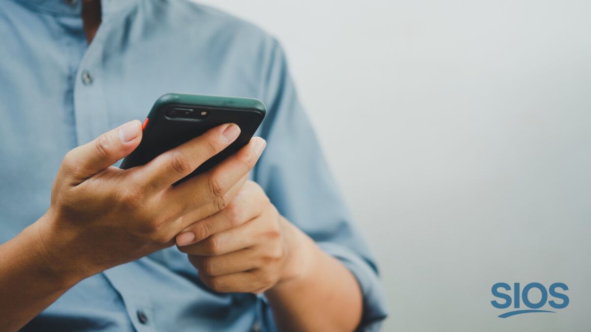 Person struggling with phone overuse during a digital detox.