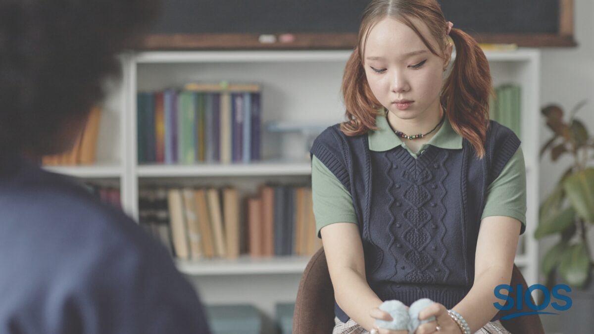 Person looking at reflection representing quiet insecurity, comparison, and confidence psychology