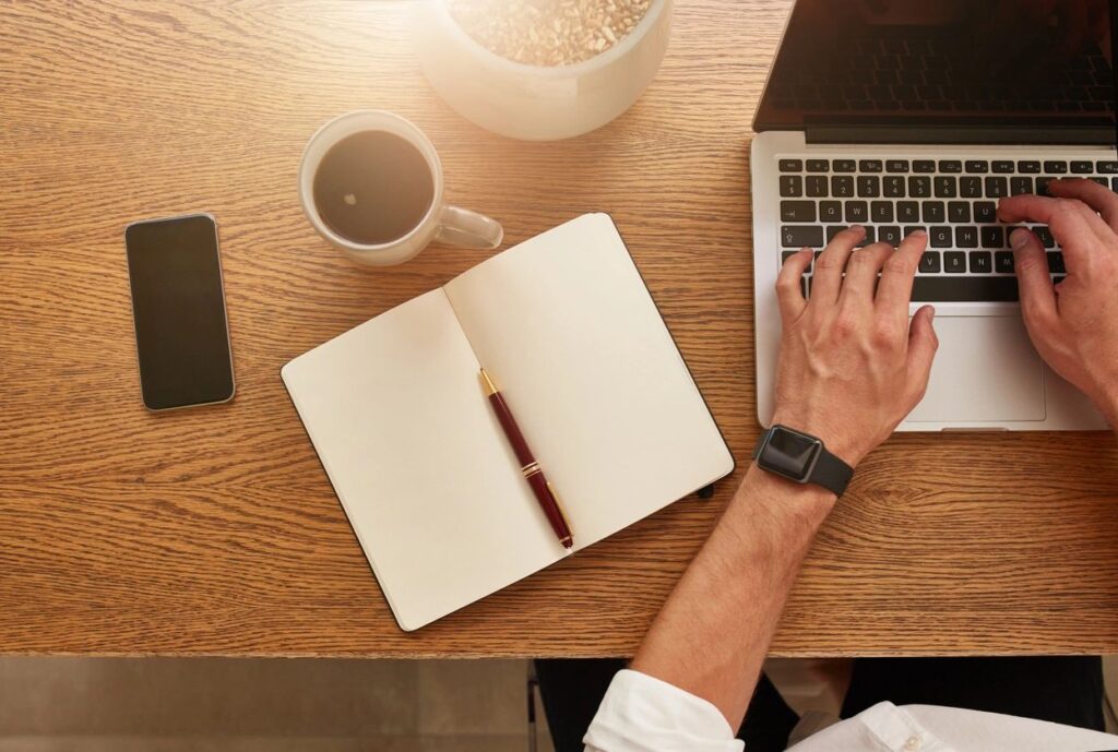 Journalist writing at his desk