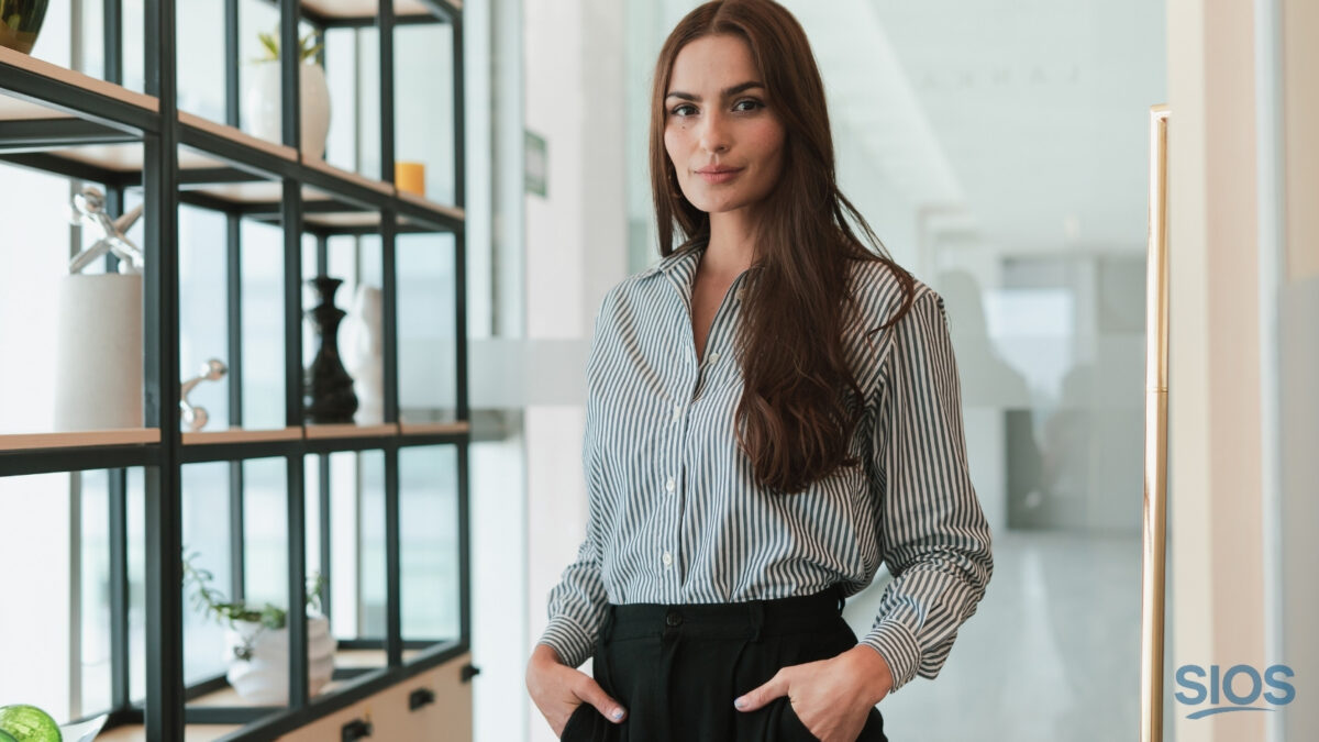 Woman standing in an office about to making an important career decision